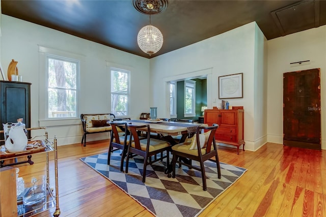 6341 Discovery Ln, Land O Lakes, FL 34638 - dining area featuring light wood-type flooring, a chandelier, and baseboards