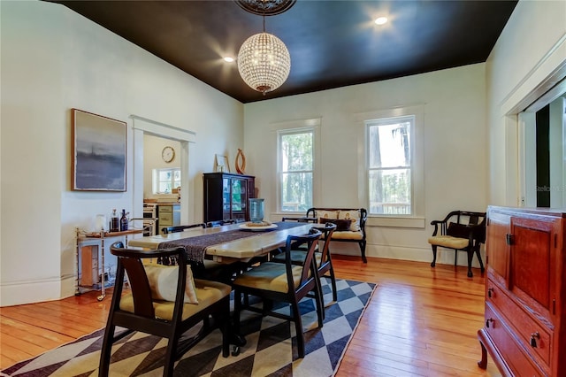 6341 Discovery Ln, Land O Lakes, FL 34638 - dining room featuring light wood-type flooring, a chandelier, and baseboards