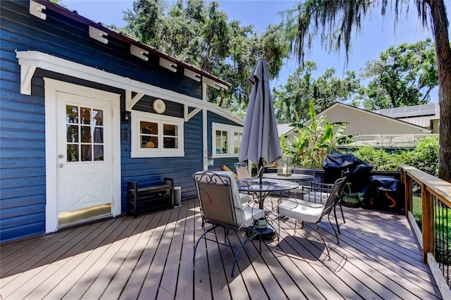 6341 Discovery Ln, Land O Lakes, FL 34638 - wooden deck featuring outdoor dining space