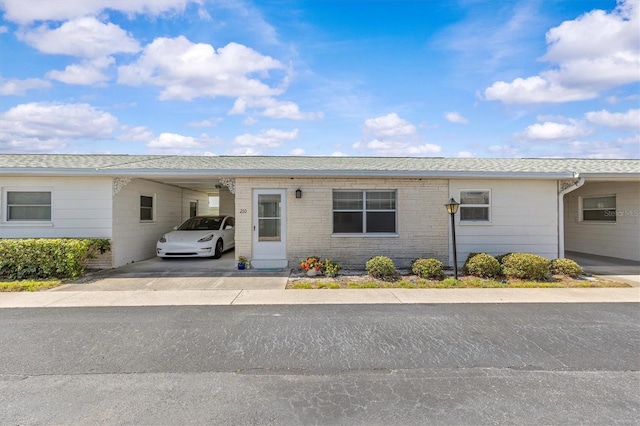 12400 Park Blvd Unit 210, Seminole, FL 33772 - ranch-style home featuring driveway and an attached carport