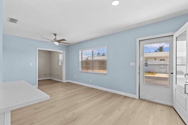 12400 Park Blvd Unit 210, Seminole, FL 33772 - unfurnished living room with ceiling fan, visible vents, baseboards, and light wood finished floors