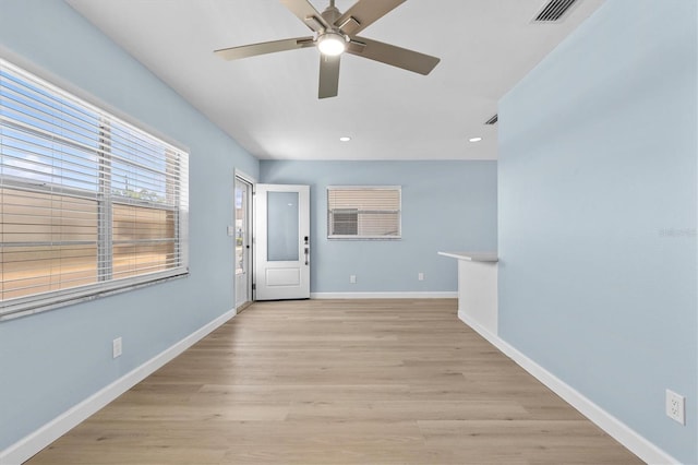 12400 Park Blvd Unit 210, Seminole, FL 33772 - entryway with ceiling fan, light wood-style flooring, recessed lighting, baseboards, and visible vents