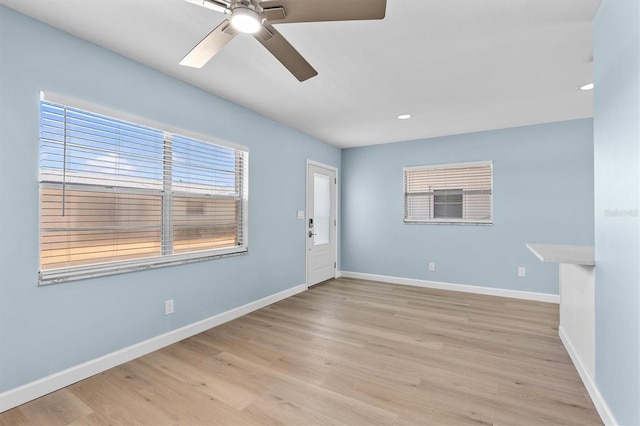 12400 Park Blvd Unit 210, Seminole, FL 33772 - spare room with light wood-style floors, baseboards, a ceiling fan, and recessed lighting