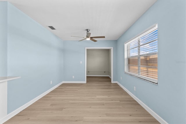 12400 Park Blvd Unit 210, Seminole, FL 33772 - unfurnished room with baseboards, ceiling fan, light wood-type flooring, and visible vents