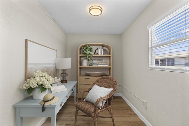 12400 Park Blvd Unit 210, Seminole, FL 33772 - sitting room with baseboards and wood finished floors