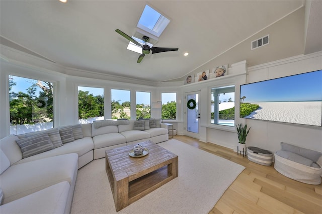 945 Bunker View Dr, Apollo Beach, FL 33572 - living room with visible vents, wood finished floors, lofted ceiling with skylight, recessed lighting, and a ceiling fan