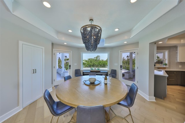 945 Bunker View Dr, Apollo Beach, FL 33572 - dining space featuring recessed lighting, light wood finished floors, and a tray ceiling