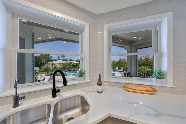 945 Bunker View Dr, Apollo Beach, FL 33572 - room details featuring a sink and light stone countertops