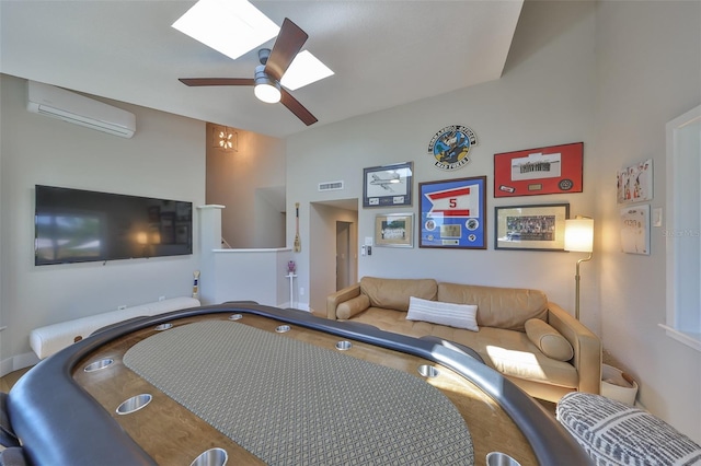 945 Bunker View Dr, Apollo Beach, FL 33572 - interior space featuring an AC wall unit, ceiling fan, visible vents, and a skylight