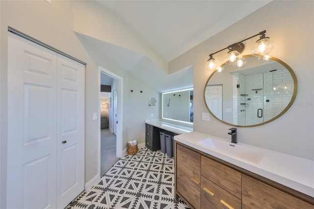 945 Bunker View Dr, Apollo Beach, FL 33572 - full bath with a sink, tile patterned flooring, two vanities, a shower stall, and lofted ceiling