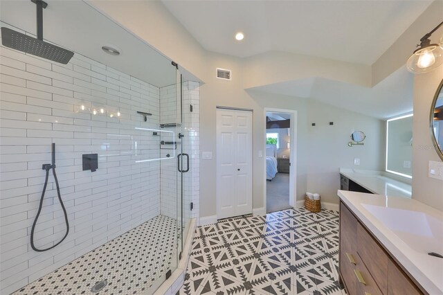 945 Bunker View Dr, Apollo Beach, FL 33572 - ensuite bathroom featuring tile patterned flooring, vanity, a shower stall, ensuite bathroom, and visible vents