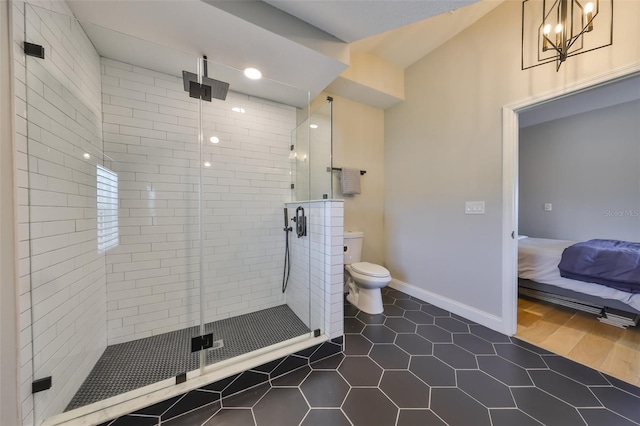 945 Bunker View Dr, Apollo Beach, FL 33572 - ensuite bathroom with ensuite bath, toilet, tile patterned floors, baseboards, and a shower stall