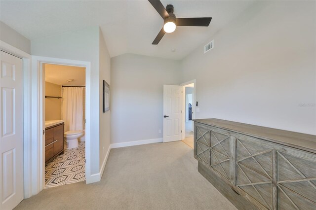 945 Bunker View Dr, Apollo Beach, FL 33572 - corridor with visible vents, baseboards, vaulted ceiling, and light colored carpet