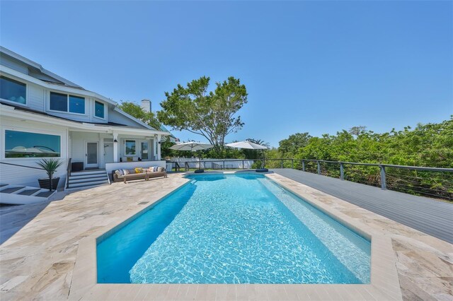945 Bunker View Dr, Apollo Beach, FL 33572 - view of swimming pool with a patio, a fenced in pool, and an outdoor hangout area