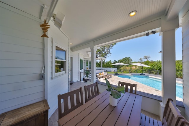 945 Bunker View Dr, Apollo Beach, FL 33572 - wooden terrace with a fenced in pool, a patio, and outdoor dining area