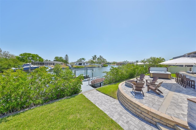 945 Bunker View Dr, Apollo Beach, FL 33572 - view of yard featuring a water view, a hot tub, a patio area, and a dock
