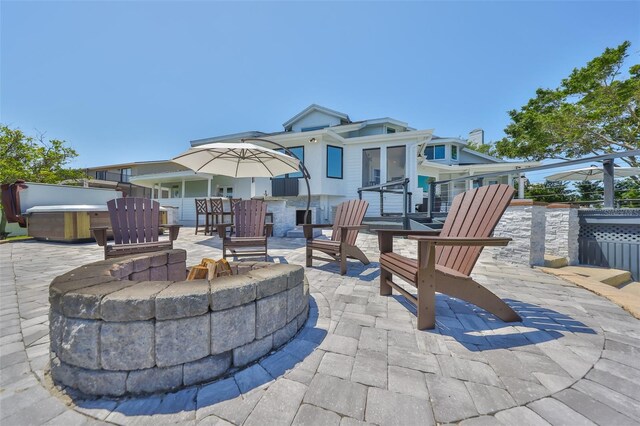 945 Bunker View Dr, Apollo Beach, FL 33572 - view of patio / terrace with a hot tub and a fire pit
