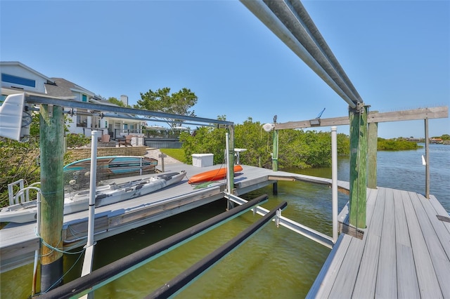 945 Bunker View Dr, Apollo Beach, FL 33572 - dock area featuring a water view and boat lift