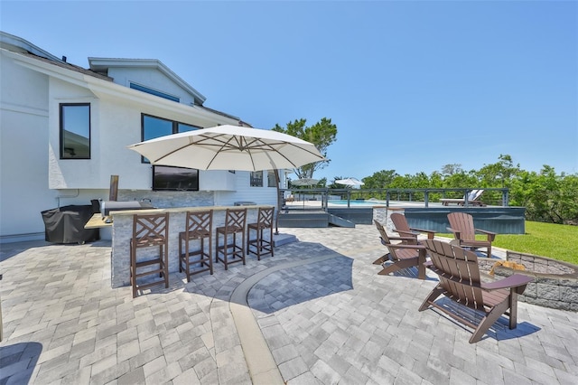 945 Bunker View Dr, Apollo Beach, FL 33572 - view of patio / terrace with outdoor dry bar and a hot tub