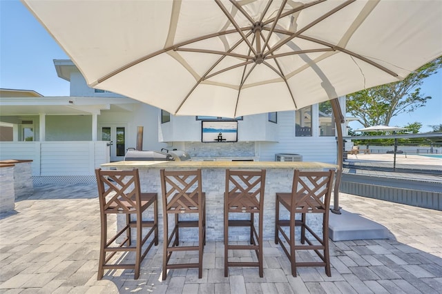 945 Bunker View Dr, Apollo Beach, FL 33572 - view of patio / terrace featuring cooling unit, french doors, and outdoor wet bar