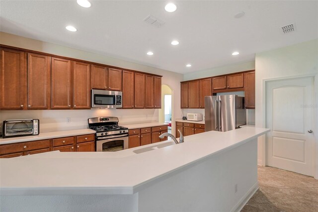 kitchen featuring visible vents, appliances with stainless steel finishes, a sink, a toaster, and recessed lighting