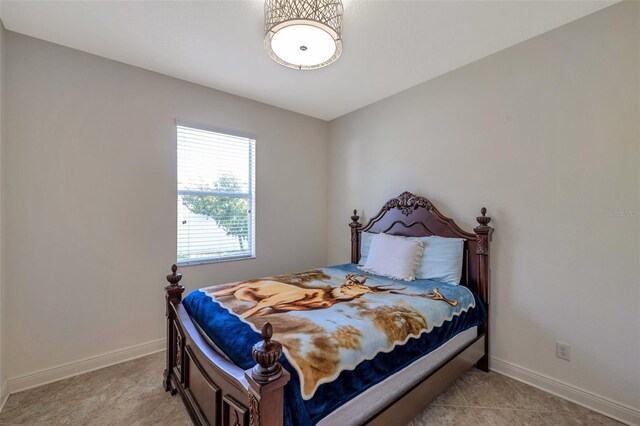 bedroom featuring baseboards