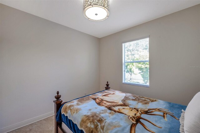 bedroom featuring baseboards