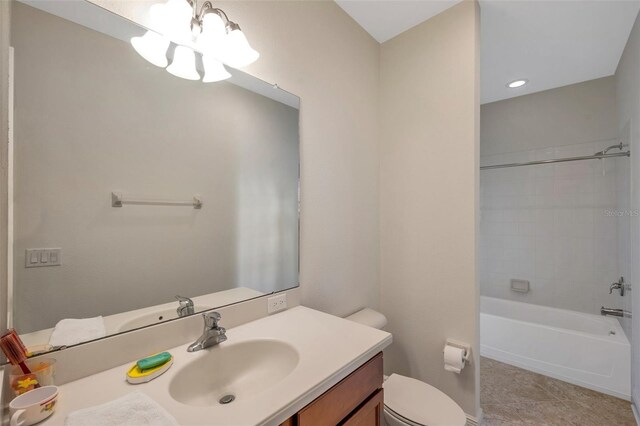 bathroom with vanity, tile patterned flooring, toilet, a chandelier, and  shower combination