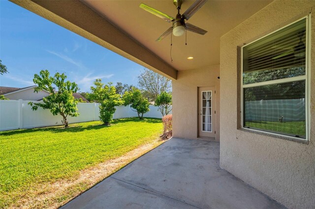 view of patio with ceiling fan and a fenced backyard