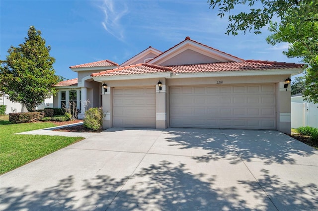 2218 Valterra Vista Way, Valrico, FL 33594 - mediterranean / spanish house featuring stucco siding, an attached garage, driveway, and a tiled roof