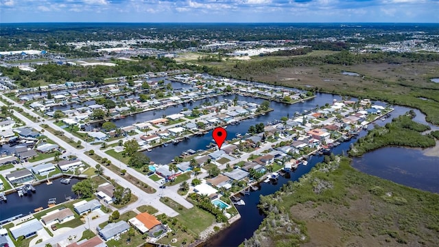 bird's eye view with a water view and a residential view