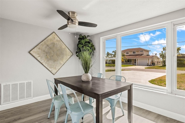 12700 5th Isle, Hudson, FL 34667 - dining space featuring healthy amount of natural light, baseboards, wood finished floors, and a ceiling fan