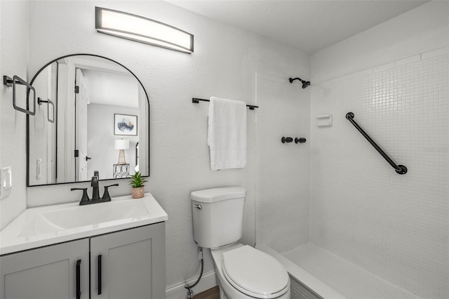 12700 5th Isle, Hudson, FL 34667 - bathroom with toilet, a tile shower, and vanity