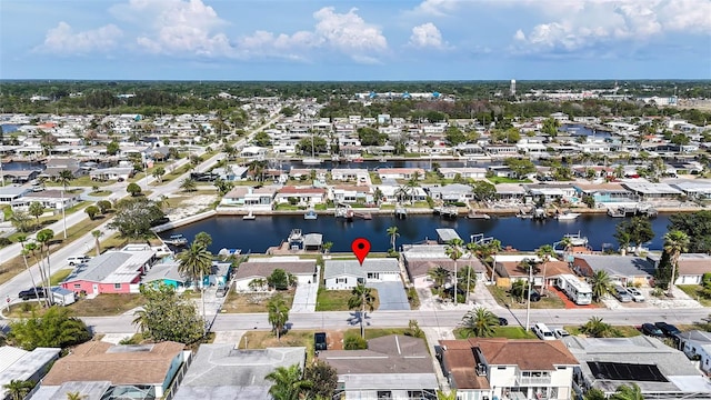 12700 5th Isle, Hudson, FL 34667 - aerial view of property and surrounding area with nearby suburban area and a large body of water