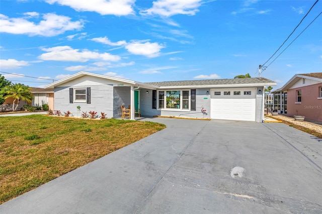 12700 5th Isle, Hudson, FL 34667 - ranch-style house with an attached garage, driveway, and a front yard