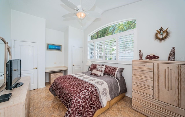 bedroom featuring ceiling fan and vaulted ceiling
