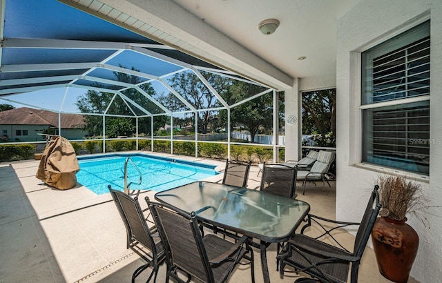 pool with glass enclosure, outdoor dining space, and a patio area