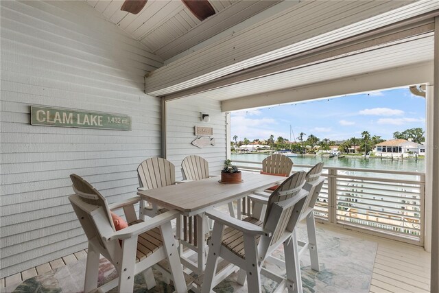 350 Pinellas Bayway S Unit 7, Tierra Verde, FL 33715 - dining room with a healthy amount of sunlight, a water view, and lofted ceiling
