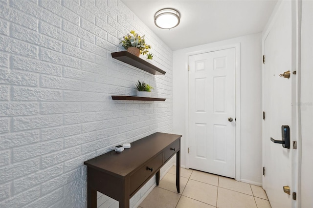 doorway to outside featuring light tile patterned floors