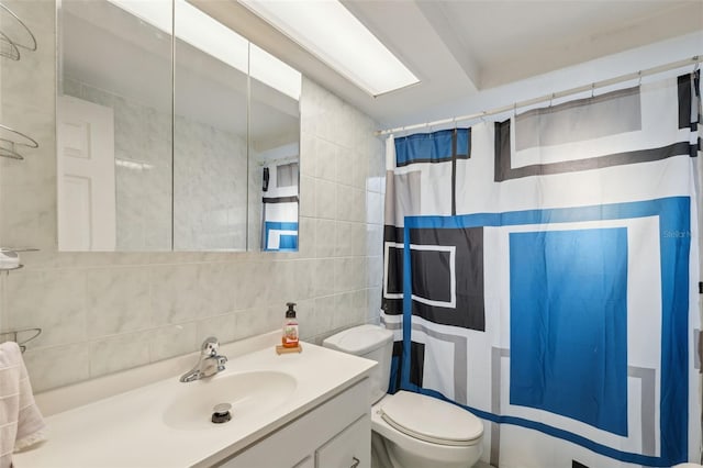 bathroom with vanity, tile walls, a shower with curtain, and toilet