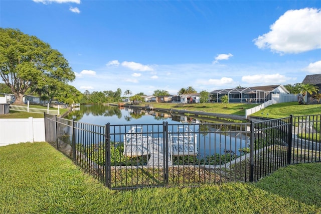 property view of water featuring a residential view and fence