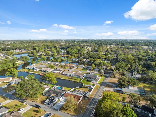 birds eye view of property with a water view and a residential view