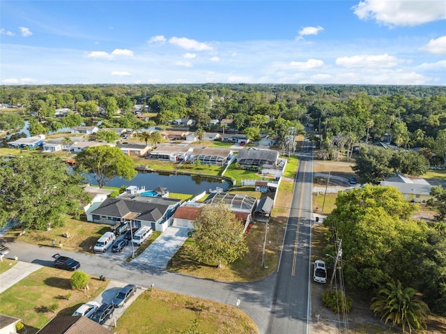 bird's eye view with a water view and a residential view