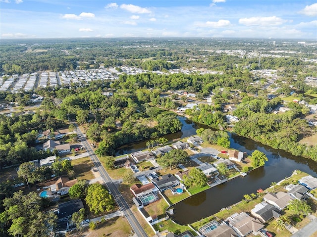 drone / aerial view featuring a water view and a residential view