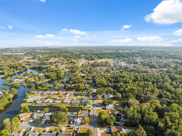 drone / aerial view featuring a water view and a residential view