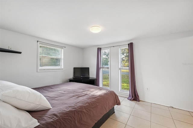 bedroom featuring light tile patterned floors