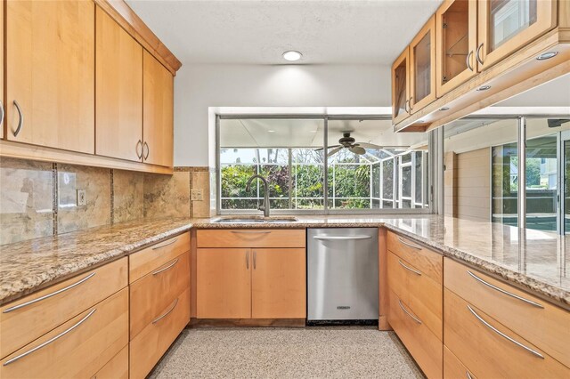 1141 80th Street Ct S, Saint Petersburg, FL 33707 - kitchen featuring a sink, healthy amount of natural light, a ceiling fan, and decorative backsplash