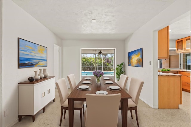 1141 80th Street Ct S, Saint Petersburg, FL 33707 - dining room featuring baseboards and ceiling fan
