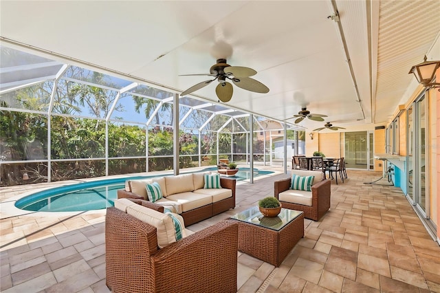 1141 80th Street Ct S, Saint Petersburg, FL 33707 - swimming pool featuring an outdoor hangout area, a patio area, a ceiling fan, and a lanai