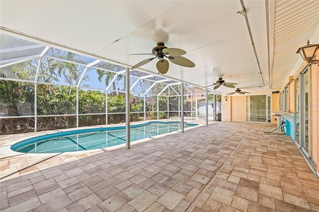 1141 80th Street Ct S, Saint Petersburg, FL 33707 - outdoor pool featuring a patio, ceiling fan, and a lanai
